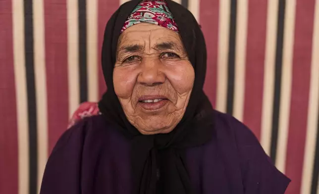 Lalla Fatouma Boulkmah, who works at a cooperative that extracts and produces argan oil and products, poses for a portrait, in Essaouira, Morocco, Thursday, May 22, 2025. (AP Photo/Mosa'ab Elshamy)
