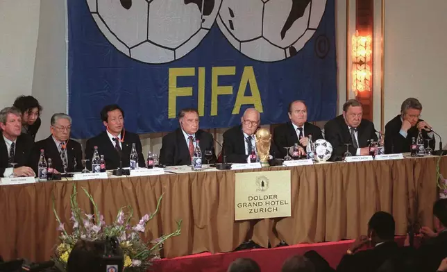 FILE - Members of the FIFA board, from left, Keith Cooper, Ken Naganuma, Mong-Joon Chung, Guillermo Canedo, Joao Havelange, Sepp Blatter, Lennart Johansson and Antonio Matarrese are seen in Zurich on May 31, 1996. (Christoph Ruckstuhl/Keystone via AP)