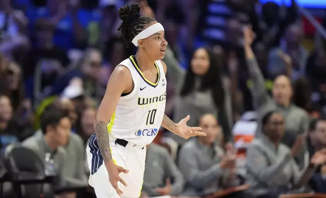 Dallas Wings guard Aziaha James celebrates after sinking a three-point basket in the first half of a WNBA basketball game against the Phoenix Mercury Thursday, July 3, 2025, in Arlington, Texas. (AP Photo/Tony Gutierrez)