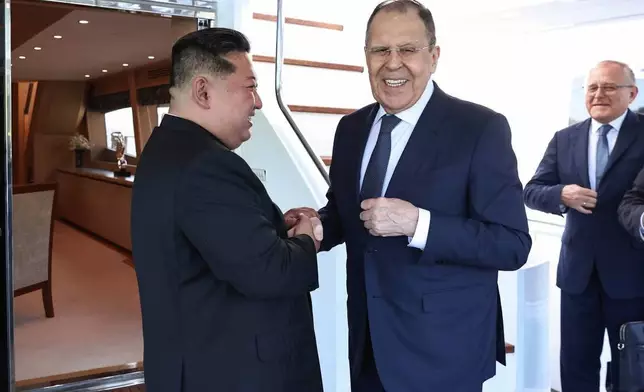 In this photo released by Russian Foreign Ministry Press Service, Russian Foreign Minister Sergey Lavrov, right, and North Korea's leader Kim Jong Un shake hands during their meeting in Wonsan, North Korea, on Saturday, July 12, 2025. (Russian Foreign Ministry Press Service via AP)