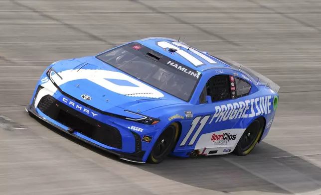 Denny Hamlin drives through Turn 2 during a NASCAR Cup Series auto race at Dover Motor Speedway, Sunday, July 20, 2025, in Dover, Del. (AP Photo/Derik Hamilton)