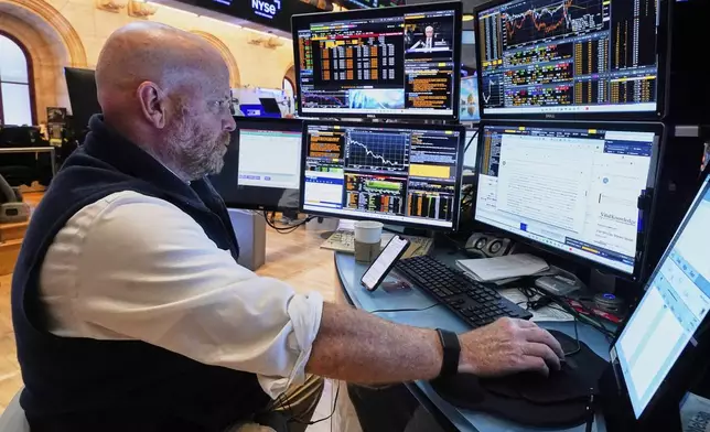 Trader Steven Gohl works on the floor of the New York Stock Exchange, Monday, July 21, 2025. (AP Photo/Richard Drew)