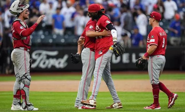 Players of Cincinnati Reds celebrate after winning a baseball game against the New York Mets, Saturday, July 19, 2025, in New York. (AP Photo/Yuki Iwamura)