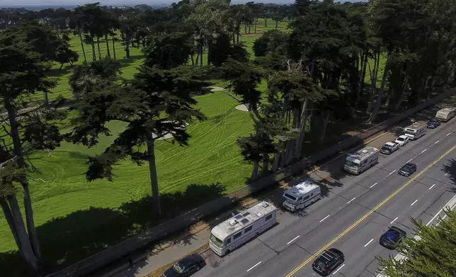 Motorists travel past RVs parked on Lake Merced Boulevard in San Francisco, Tuesday, July 15, 2025. (AP Photo/Godofredo A. Vásquez)