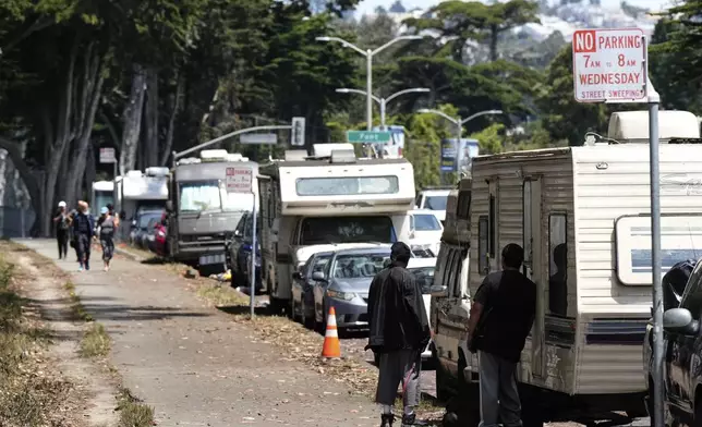Parked RVs are seen on Lake Merced Boulevard in San Francisco, Tuesday, July 15, 2025. (AP Photo/Godofredo A. Vásquez)