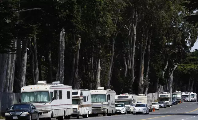 Parked RVs are seen on Lake Merced Boulevard in San Francisco, Tuesday, July 15, 2025. (AP Photo/Godofredo A. Vásquez)