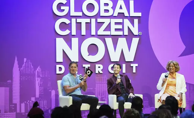Mark Cuban, from left, Andrew Leon Hanna, and Anika Goss speak on a panel at a Global Citizen NOW event in Detroit, Thursday, July 10, 2025. (AP Photo/Paul Sancya)