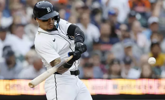 Detroit Tigers' Javier Báez hits a two-run home run against the Tampa Bay Rays during the second inning of a baseball game Monday, July 7, 2025, in Detroit. (AP Photo/Duane Burleson)