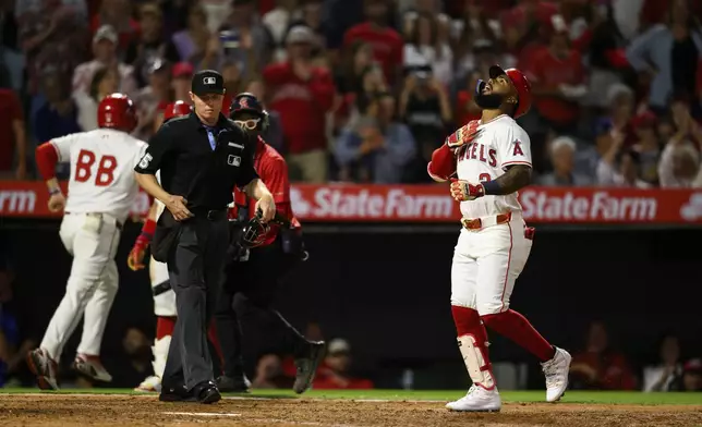 Los Angeles Angels' Luis Rengifo gestures after scoring on a home run during the sixth inning of a baseball game against the Texas Rangers, Monday, July 28, 2025, in Anaheim, Calif. (AP Photo/William Liang)