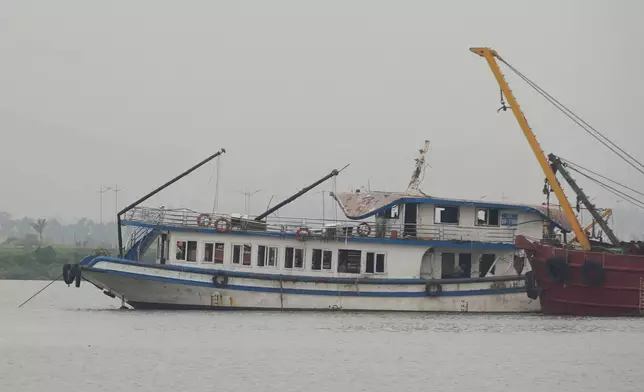 Tourist boat Wonder Sea is towed to a shipyard for investigation after its capsizing, which killed multiple people, in a thunderstorm in Ha Long Bay, Vietnam Sunday, July 20, 2025. (AP Photo/Huy Han)