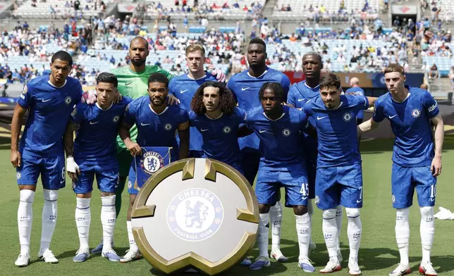Chelsea's starting players pose for a team photo at the beginning of a Club World Cup round of 16 soccer match between Benfica and Chelsea in Charlotte, N.C., Saturday, June 28, 2025. (AP Photo/Nell Redmond)