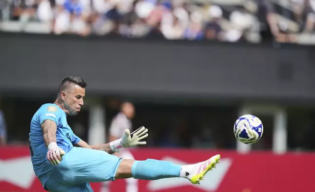 Fluminense goalkeeper Fabio (1) kicks the ball during the Club World Cup semifinal soccer match between Fluminense and Chelsea in East Rutherford, N.J., Tuesday, July 8, 2025. (AP Photo/Seth Wenig)