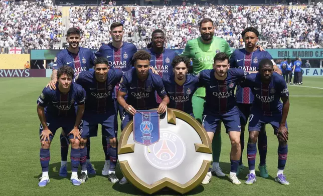 Paris Saint-Germain's starting 11 pose for a team photo before the Club World Cup semifinal soccer match between PSG and Real Madrid in East Rutherford, N.J., Wednesday, July 9, 2025. (AP Photo/Seth Wenig)