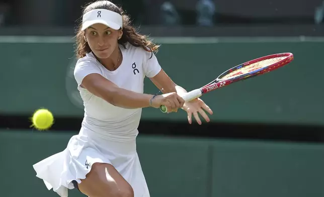 Julieta Pareja of the U.S. returns to Slovakia's Mia Pohankova during the final of the girls singles at the Wimbledon Tennis Championships in London, Saturday, July 12, 2025. (AP Photo/Dave Shopland)