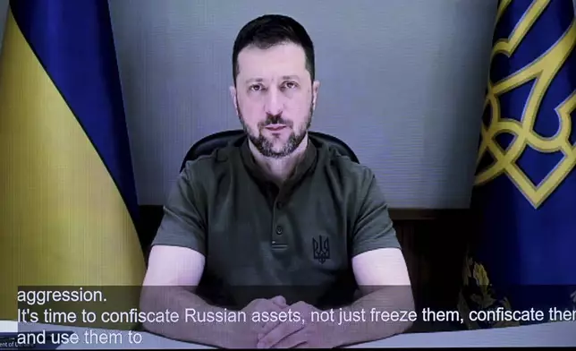 Ukraine's President Volodymyr Zelenskyy addresses online the opening of the Helsinki+50 Conference in Helsinki, Finland, Thursday, July 31, 2025. (Mikko Stig/Lehtikuva via AP)