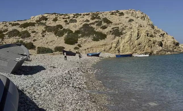 Boats used by migrants to cross the Mediterranean Sea are seen at Tripiti beach, Gavdos island , Greece, the southernmost point of Europe, on Monday, July 7, 2025. (AP Photo/Elena Becatoros)