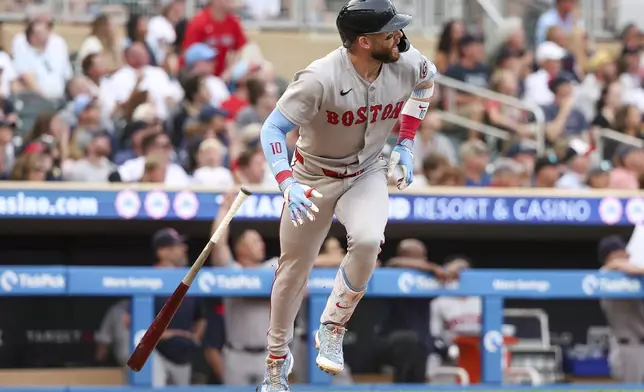 Boston Red Sox Trevor Story watches his two run home run against the Minnesota Twins during the third inning of baseball game Tuesday, July 29, 2025, in Minneapolis. (AP Photo/Matt Krohn)