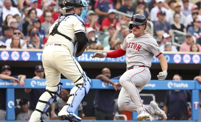Boston Red Sox designated hitter Roman Anthony scores on a double hit by Alex Bregman during the third inning of baseball game against the Minnesota Twins Tuesday, July 29, 2025, in Minneapolis. (AP Photo/Matt Krohn)