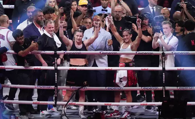 Ireland's Katie Taylor, left, and Puerto Rico's Amanda Serrano pose after a super lightweight championship boxing match Saturday, July 12, 2025, in New York. (AP Photo/Frank Franklin II)