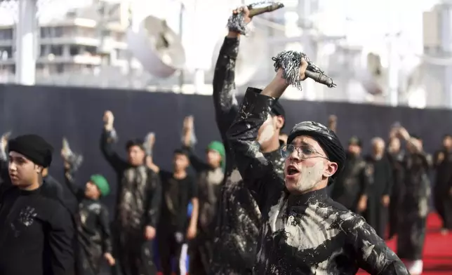 Shiite faithful worshippers gather between the holy shrines of Imam Hussein and Imam Abbas, during Muharram, a period of mourning for Shiites, in Karbala, Iraq, Saturday, July. 5, 2025. (AP Photo/Anmar Khalil)