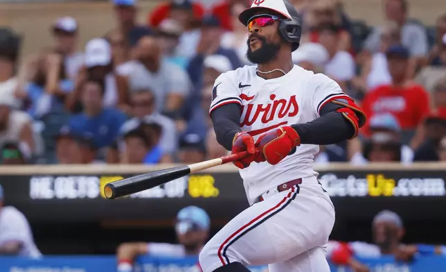 CORRECTS TO ONE-RUN DOUBLE NOT TWO-RBI DOUBLE - Minnesota Twins' Byron Buxton hits a one-run double against the Tampa Bay Rays in the seventh inning of a baseball game Friday, July 4, 2025, in Minneapolis. (AP Photo/Bruce Kluckhohn)