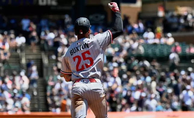 Minnesota Twins' Byron Buxton reacts after hitting a two-run home run during the third inning of a baseball game against the Detroit Tigers, Saturday, June 28, 2025, in Detroit. (AP Photo/Jose Juarez)