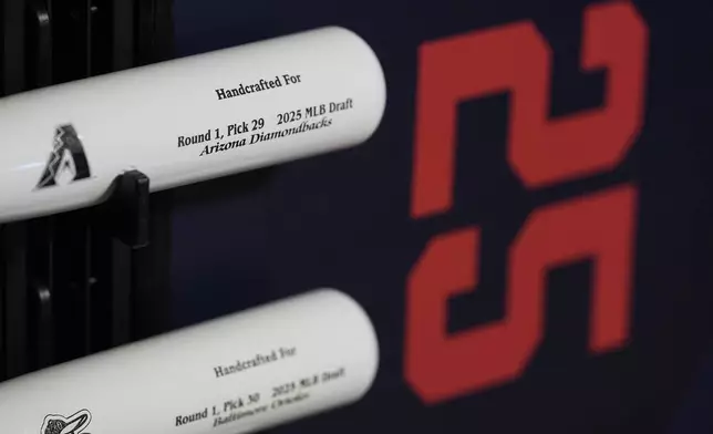 Specialized baseball bats are seen on display before the first round of the MLB baseball draft Sunday, July, 13, 2025 in Atlanta. (AP Photo/Mike Stewart)