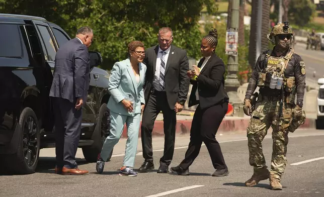 Los Angeles Mayor Karen Bass arrives at MacArthur Park, where federal agents were staging, Monday, July 7, 2025, in Los Angeles. (AP Photo/Damian Dovarganes)