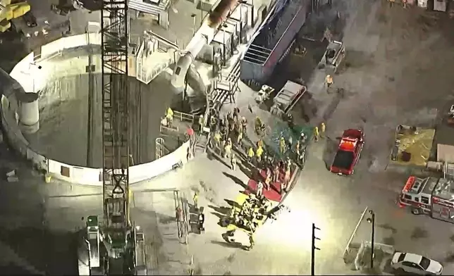 This image taken from footage provided by KABC/ABC7 Los Angeles shows first responders working the scene after a tunnel collapsed on Wednesday, July 9, 2025, in Los Angeles. (KABC/ABC7 Los Angeles via AP)