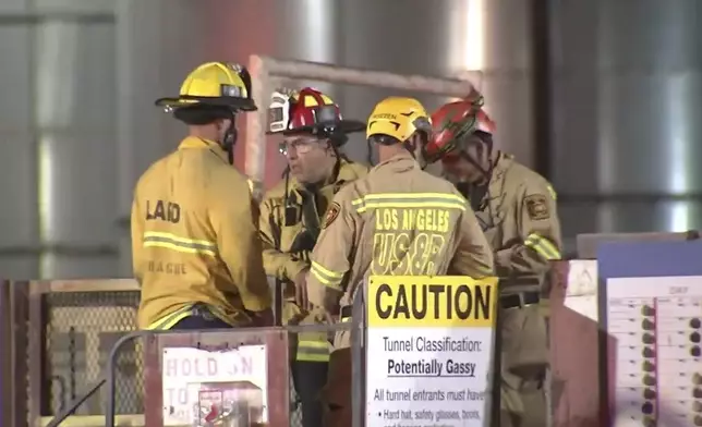 This image taken from footage provided by KABC/ABC7 Los Angeles shows first responders working the scene after a tunnel collapsed on Wednesday, July 9, 2025, in Los Angeles. (KABC/ABC7 Los Angeles via AP)