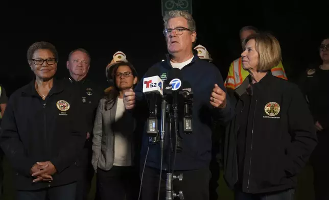 From left, Los Angeles Mayor Karen Bass, left, LAPD Chief Jim McDonnell, Congresswoman Nanette Barragan Los Angeles Council member Tim McOsker, at microphone, and Supervisor Janice Hahn take questions from the media after all the workers who were trapped in the Wilmington tunnel were out and accounted, Wednesday, July 9, 2025, in Los Angeles. (AP Photo/Damian Dovarganes)