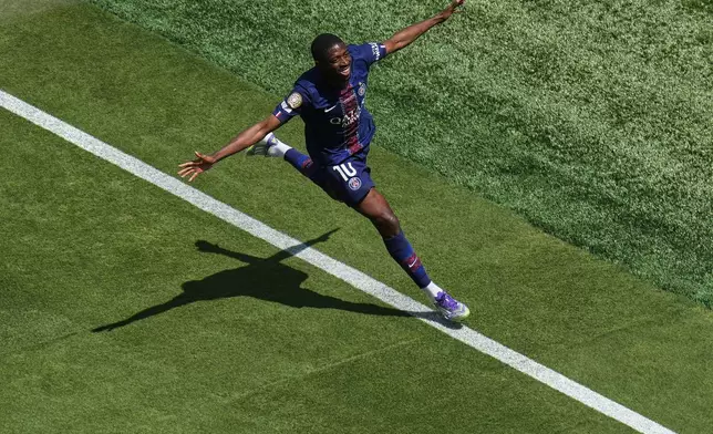 Paris Saint-Germain's Ousmane Dembele (10) celebrates after scoring during the Club World Cup semifinal soccer match between PSG and Real Madrid in East Rutherford, N.J., Wednesday, July 9, 2025. (AP Photo/Pamela Smith)
