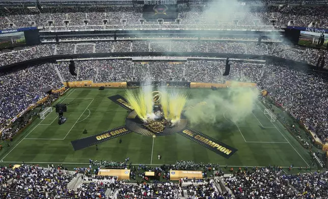 Pyrotechniques are seen during a ceremony before the Club World Cup final soccer match between Chelsea and PSG in East Rutherford, N.J., Sunday, July 13, 2025. (AP Photo/Matt Slocum)