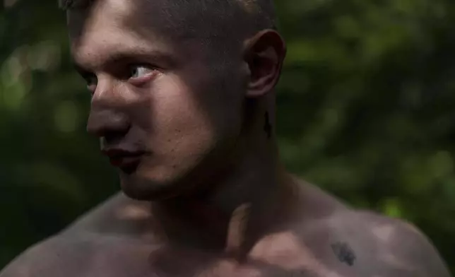 Ukrainian soldier Denys Zalizko, 21, stands outside of a rehabilitation center in Kyiv region, Ukraine, Wednesday, July 2, 2025. (AP Photo/Evgeniy Maloletka)