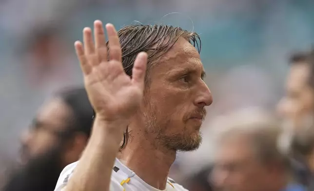 Real Madrid's Luka Modric walks off the pitch after the Club World Cup round of 16 soccer match between Real Madrid and Juventus in Miami Gardens, Fla., Tuesday, July 1, 2025. (AP Photo/Rebecca Blackwell)