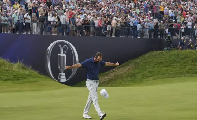 Scottie Scheffler of the United States celebrates after winning the British Open golf championship at the Royal Portrush Golf Club, Northern Ireland, Sunday, July 20, 2025. (AP Photo/Jon Super)