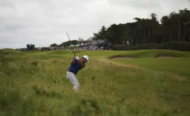 Bryson DeChambeau of the United States plays out of the rough on the 3rd hole during the first round of the British Open golf championship at the Royal Portrush Golf Club, Northern Ireland, Thursday, July 17, 2025. (AP Photo/Francisco Seco)