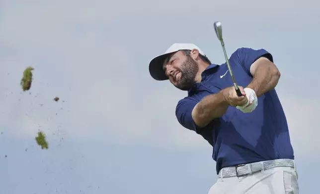 Scottie Scheffler of the United States tees of the 6th during the final round of the British Open golf championship at the Royal Portrush Golf Club, Northern Ireland, Sunday, July 20, 2025. (AP Photo/Jon Super)