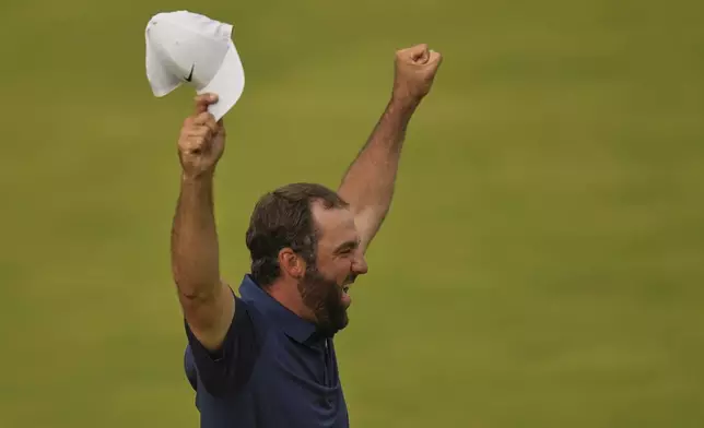 Scottie Scheffler of the United States celebrates after winning the British Open golf championship at the Royal Portrush Golf Club, Northern Ireland, Sunday, July 20, 2025. (AP Photo/Francisco Seco)