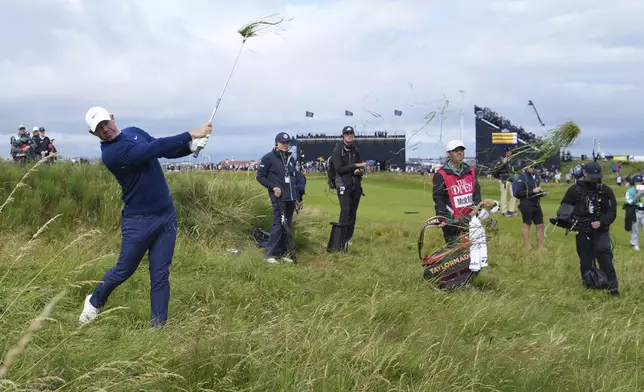 Rory McIlroy of Northern Ireland plays out of the rough on the 2nd hole during the second round of the British Open golf championship at the Royal Portrush Golf Club, Northern Ireland, Friday, July 18, 2025. (AP Photo/Jon Super)