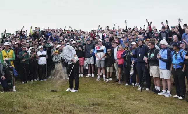 Scottie Scheffler of the United States plays out of the rough on the 17th hole during the second round of the British Open golf championship at the Royal Portrush Golf Club, Northern Ireland, Friday, July 18, 2025. (AP Photo/Jon Super)
