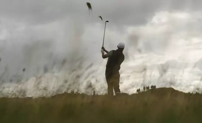Haotong Li of China plays from the rough on the 12th hole during the second round of the British Open golf championship at the Royal Portrush Golf Club, Northern Ireland, Friday, July 18, 2025. (AP Photo/Francisco Seco)