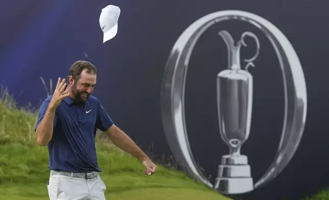 Scottie Scheffler of the United States celebrates after winning the British Open golf championship at the Royal Portrush Golf Club, Northern Ireland, Sunday, July 20, 2025. (AP Photo/Jon Super)