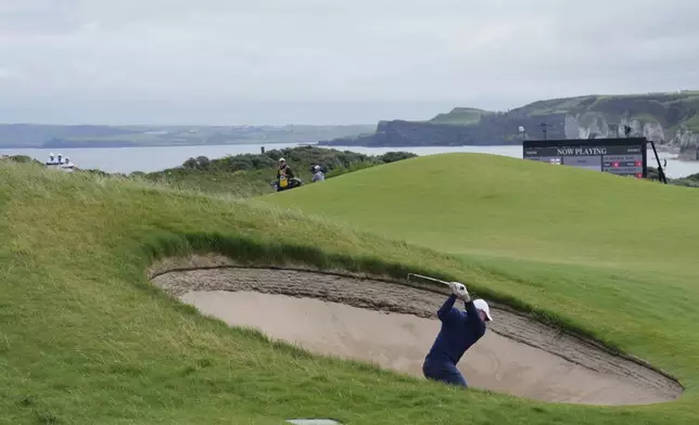 Rory McIlroy of Northern Ireland plays out of a bunker on the 5th green during the second round of the British Open golf championship at the Royal Portrush Golf Club, Northern Ireland, Friday, July 18, 2025. (AP Photo/Jon Super)