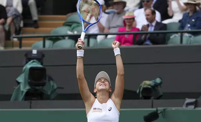 Belinda Bencic of Switzerland celebrates winning her women's singles fourth round match against Ekaterina Alexandrova of Russia at the Wimbledon Tennis Championships in London, Monday, July 7, 2025.(AP Photo/Kirsty Wigglesworth)