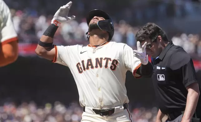 San Francisco Giants' Luis Matos celebrates after hitting a two-run home run during the ninth inning of a baseball game against the Los Angeles Dodgers in San Francisco, Sunday, July 13, 2025. (AP Photo/Jeff Chiu)