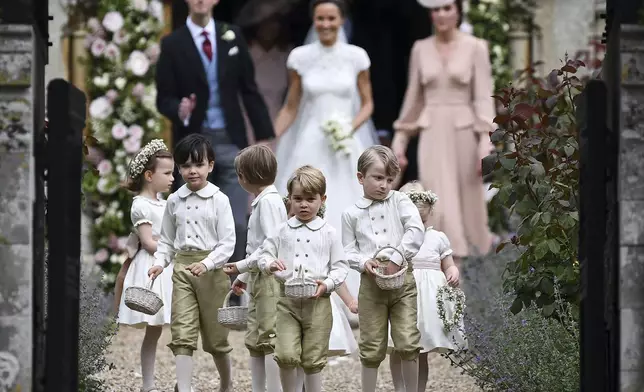 Britain's Prince George, foreground center, reacts after the wedding of his aunt, Pippa Middleton, to James Matthews, at St Mark's Church in Englefield, England, May 20, 2017. (Justin Tallis/Pool Photo via AP, File)