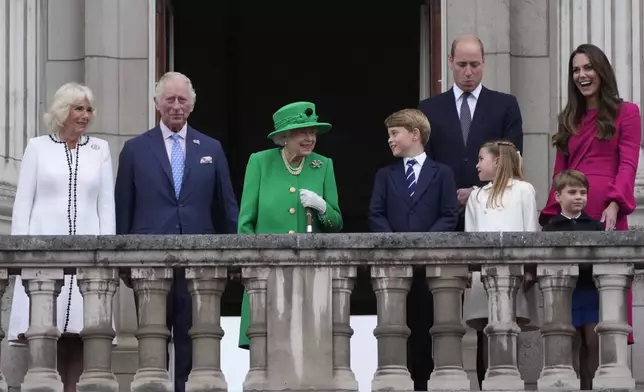 From left: Camilla Duchess of Cornwall, Prince Charles, Queen Elizabeth II, Prince George, Prince William, Princess Charlotte, Prince Louis, and Kate, Duchess of Cambridge appear on the balcony of Buckingham Palace during the Platinum Jubilee Pageant outside Buckingham Palace in London, June 5, 2022, on the last of four days of celebrations to mark the Platinum Jubilee. (AP Photo/Frank Augstein, Pool, File)