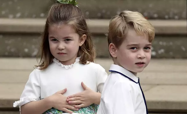 Prince George and Princess Charlotte arrive for the wedding of Princess Eugenie of York and Jack Brooksbank at St George's Chapel, Windsor Castle, near London, England, Oct. 12, 2018. (Steve Parsons/Pool via AP, File)