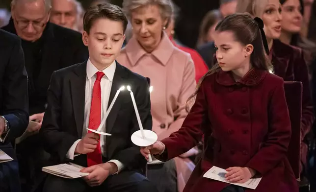 Britain's Prince George and Princess Charlotte attend the Together at Christmas carol service at Westminster Abbey, in London, Dec. 6, 2024. (Aaron Chown/Pool Photo via AP, File)